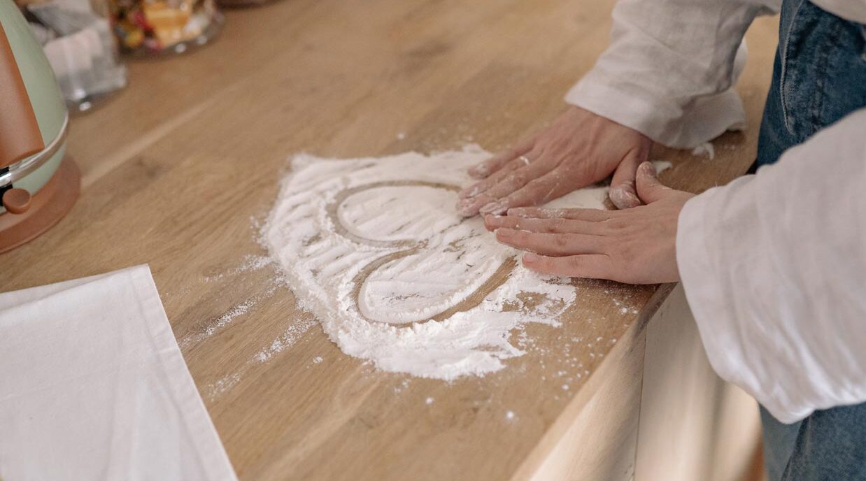 Heart made out of flour on the countertop