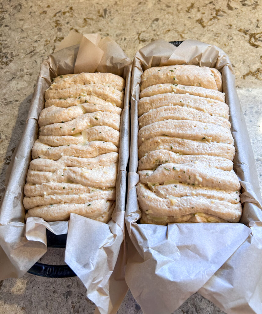 Proofed ancient grain garlic pull apart bread made with fresh milled spelt and kamut, ready for baking